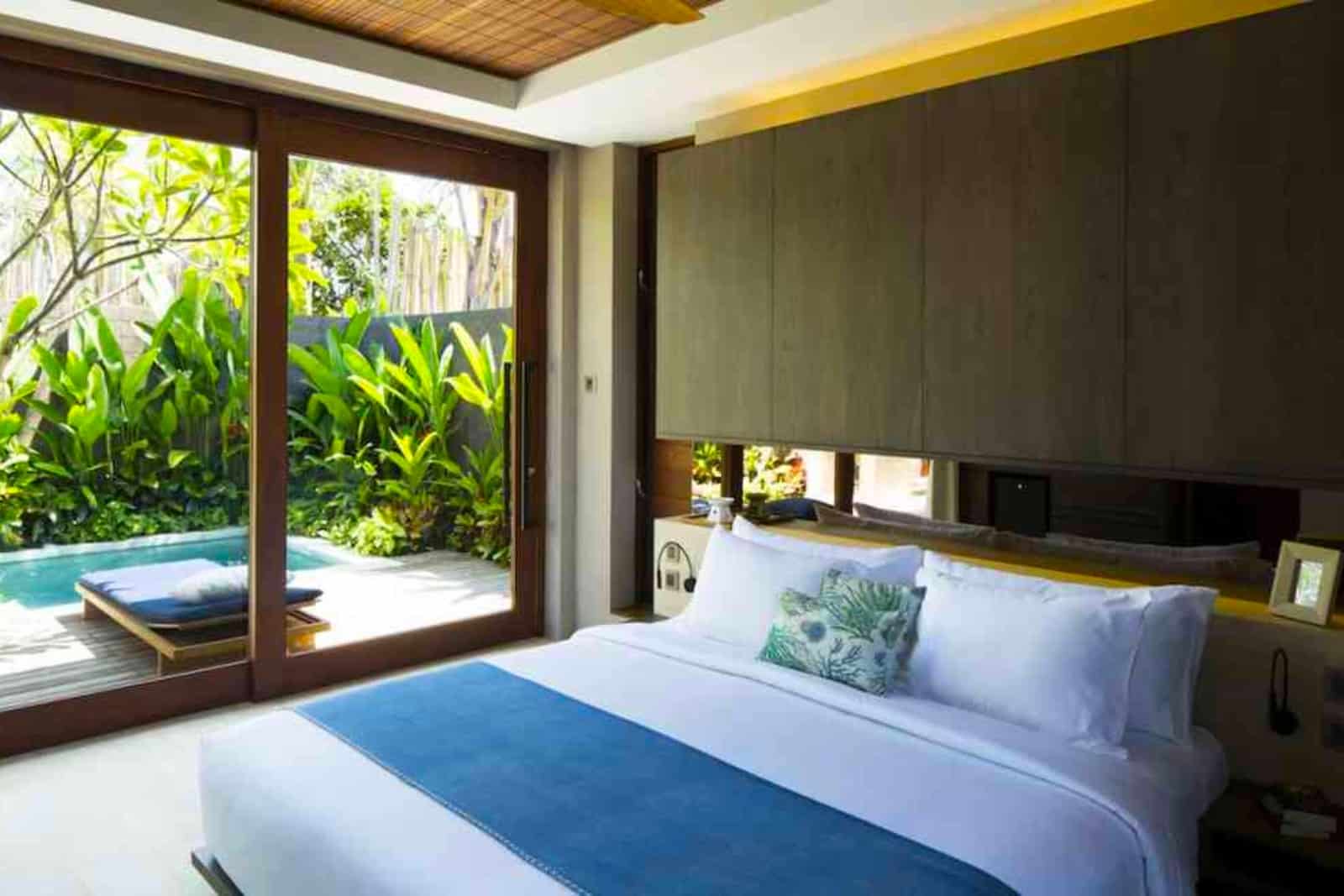 Bedroom lush views of private pool in Bali resort 2024